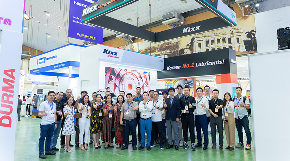 Kixx staff and visitors posing in front of the Kixx booth at MTA Hanoi 2022