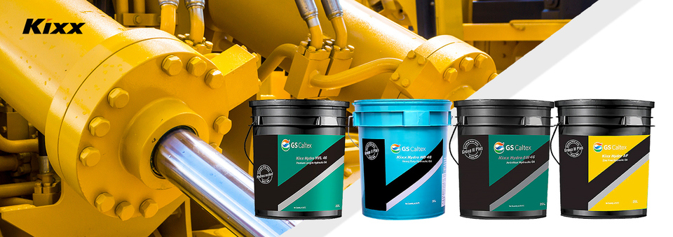 A shining yellow and chrome hydraulic system with four varieties of Kixx Hydraulic Fluid.