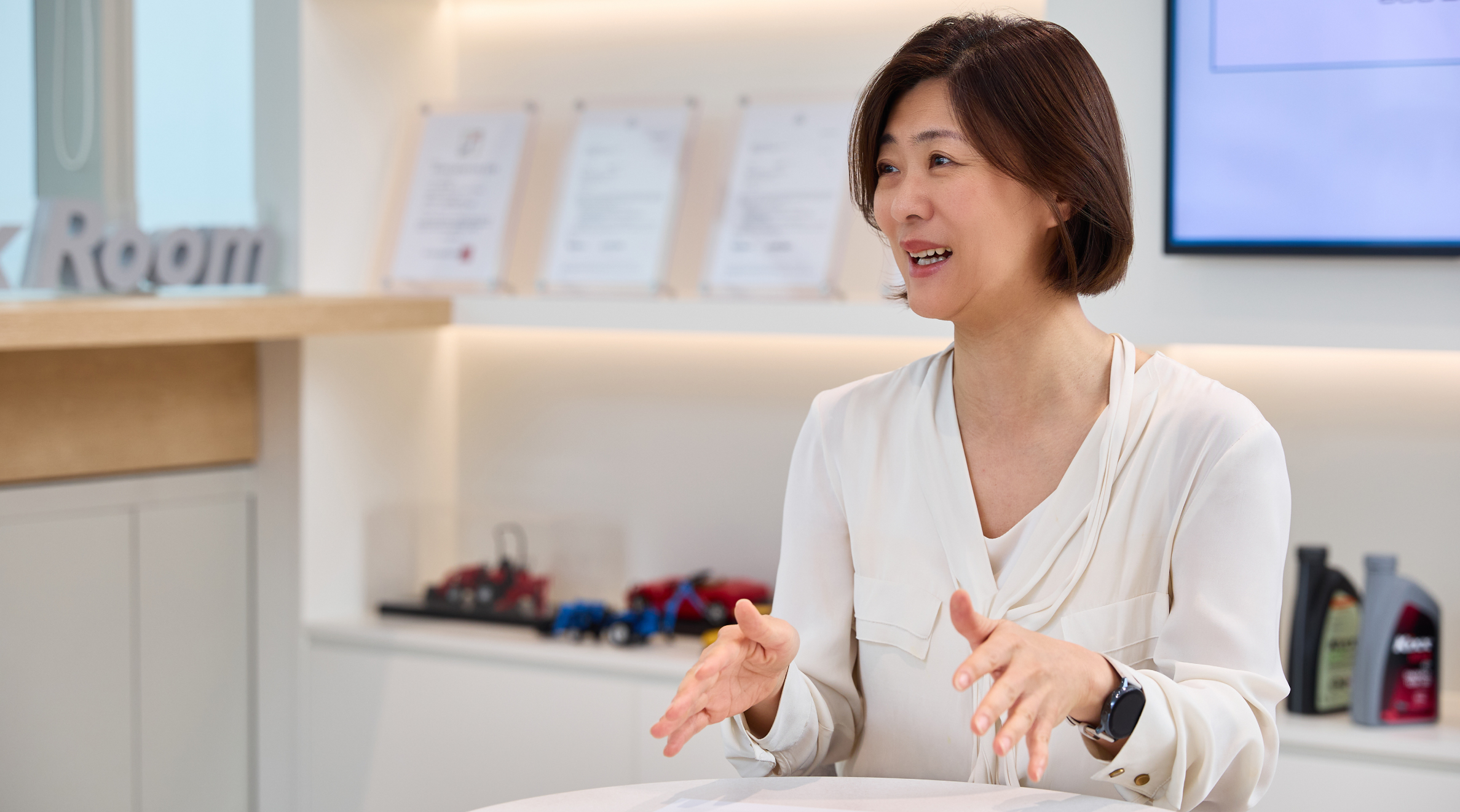 Team Leader Ji Seon Park smiles while speaking 