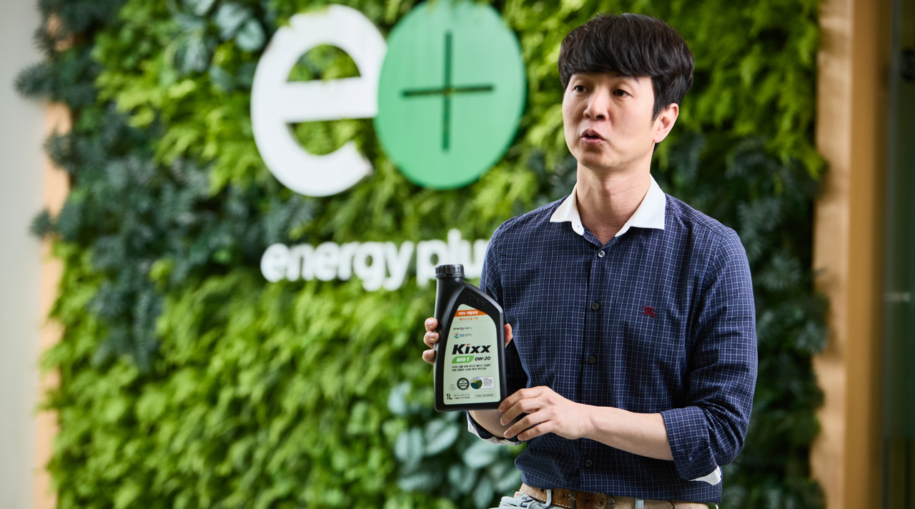 Kwan Hee Choi holds up a bottle of Kixx BIO1 as he discusses its makeup.