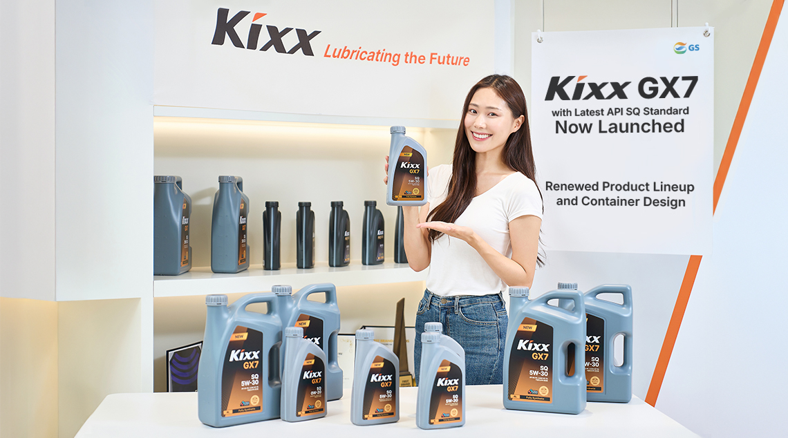 A woman wearing a white shirt and jeans models the Kixx GX7 lineup with Kixx signs in the background.