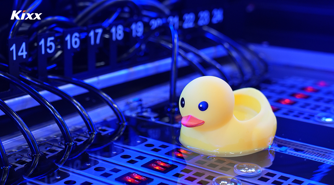 Yellow rubber duck on liquid-cooled server hardware illustrating immersion cooling technology.
