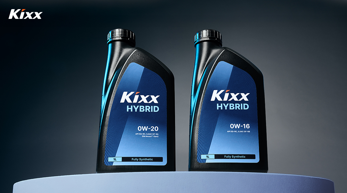 Two bottles of Kixx HYBRID sit atop a blue podium against a dark backdrop.